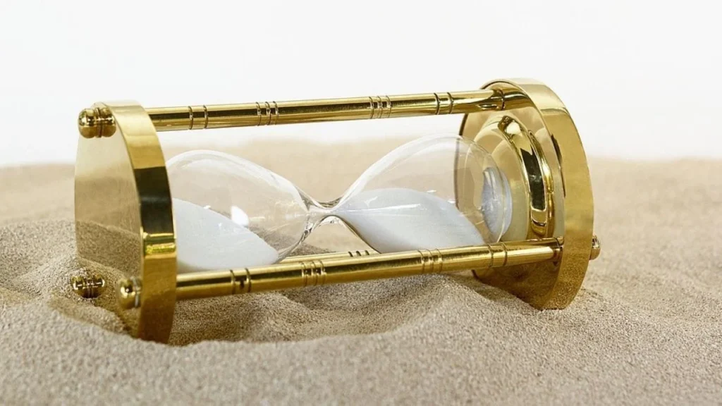 Hourglass in a bed of sand