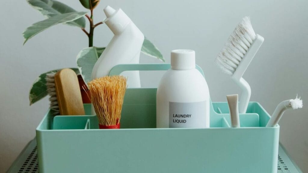 cleaning supplies organized in a basket