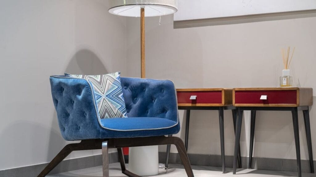 Comfortable chair, floor lamp, accent table for an intentional home design for a comfortable private corner.