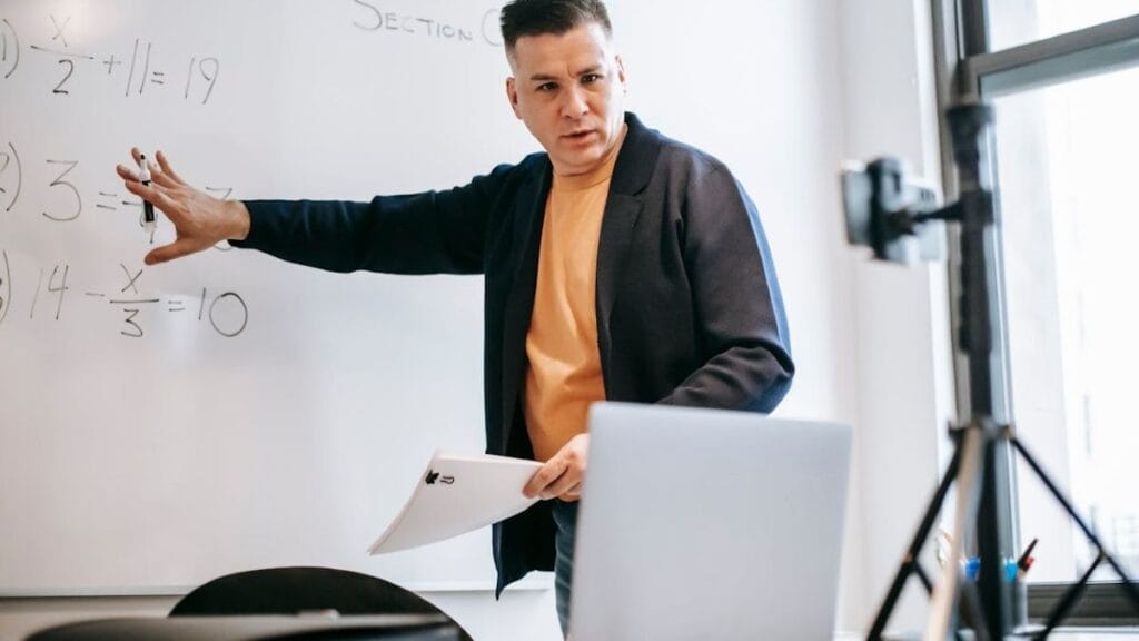 man recording online course using digital equipment.