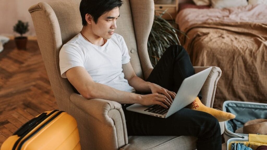 digital nomad working on his laptop