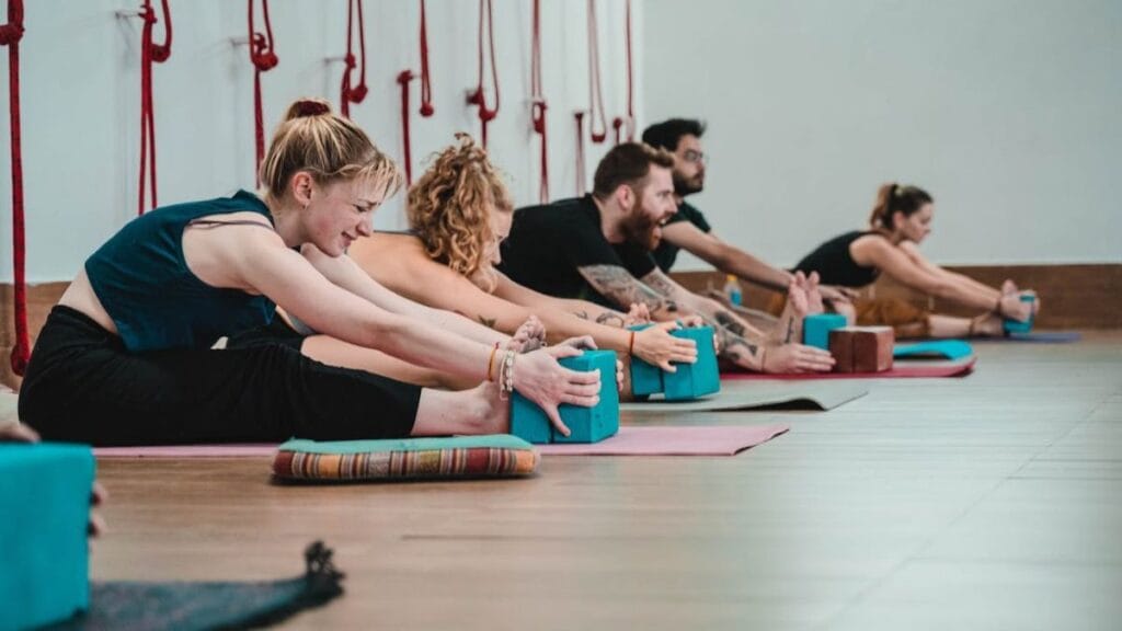 people stretching during a yoga class.