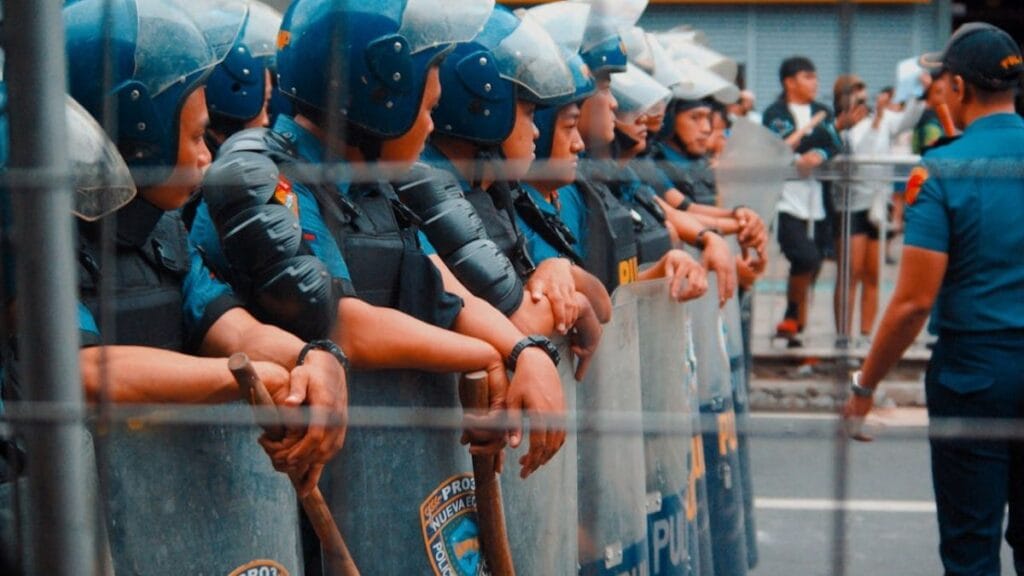 police on the street in riot gear.