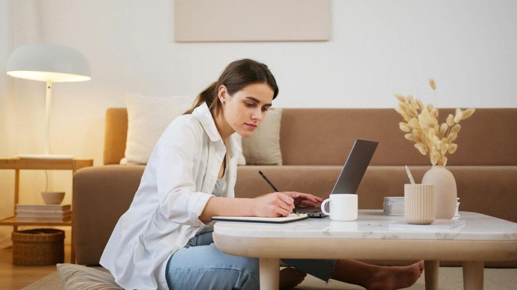 Woman learning online on her laptop in her house.