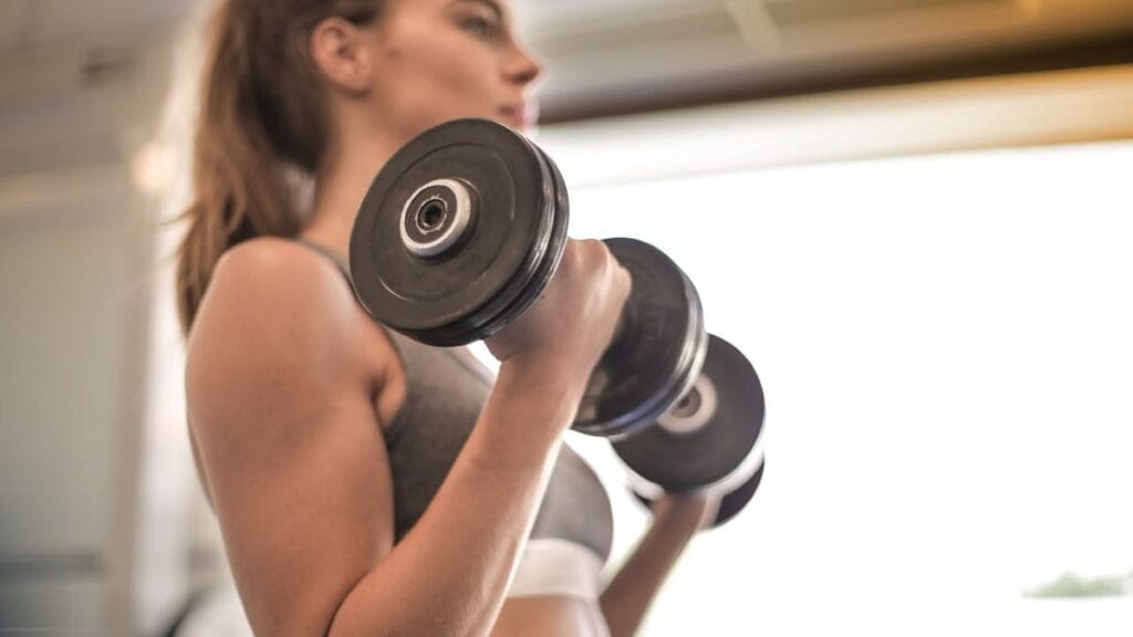 woman training with dumbbells