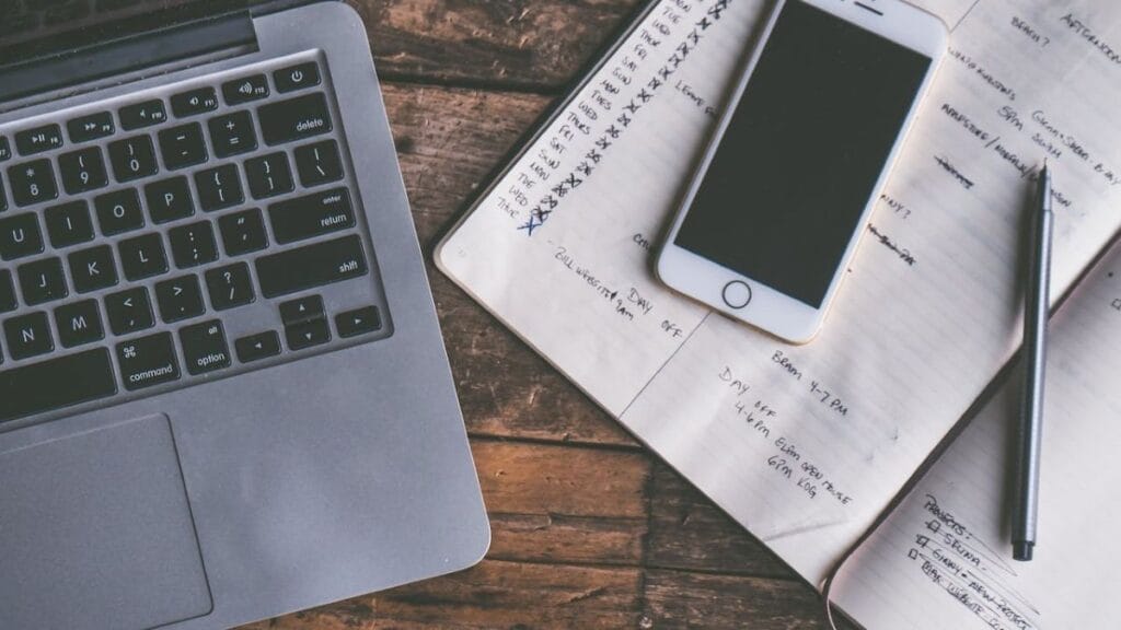 planner, pen, and laptop