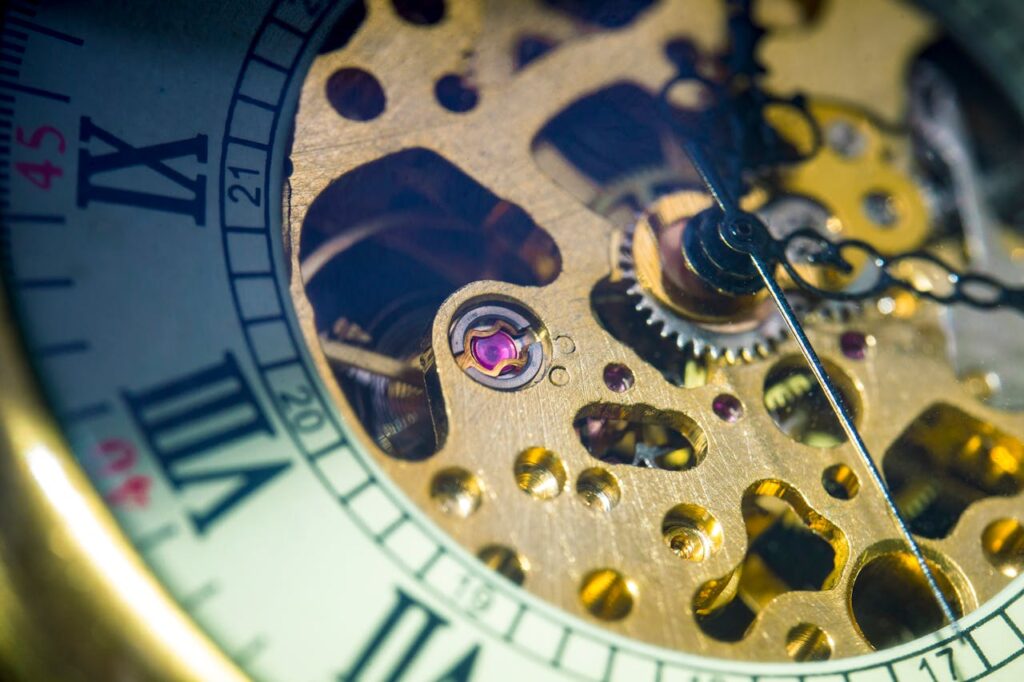 Gears inside a mechanical clock with part of the clock face, creating a visual metaphor for flexible lifestyle.