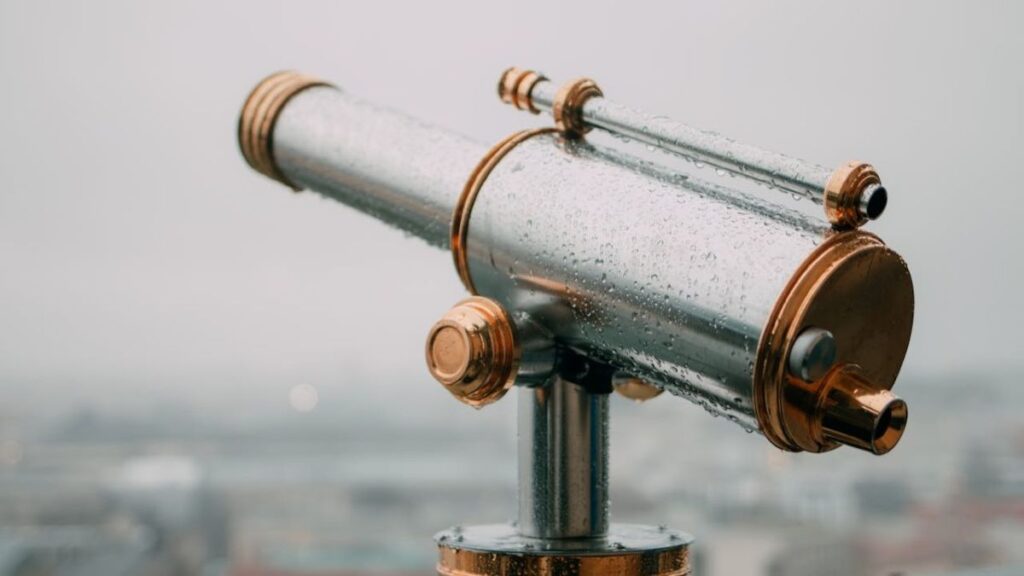 telescope overlooking horizon, a symbol for vision you need for life design changes.