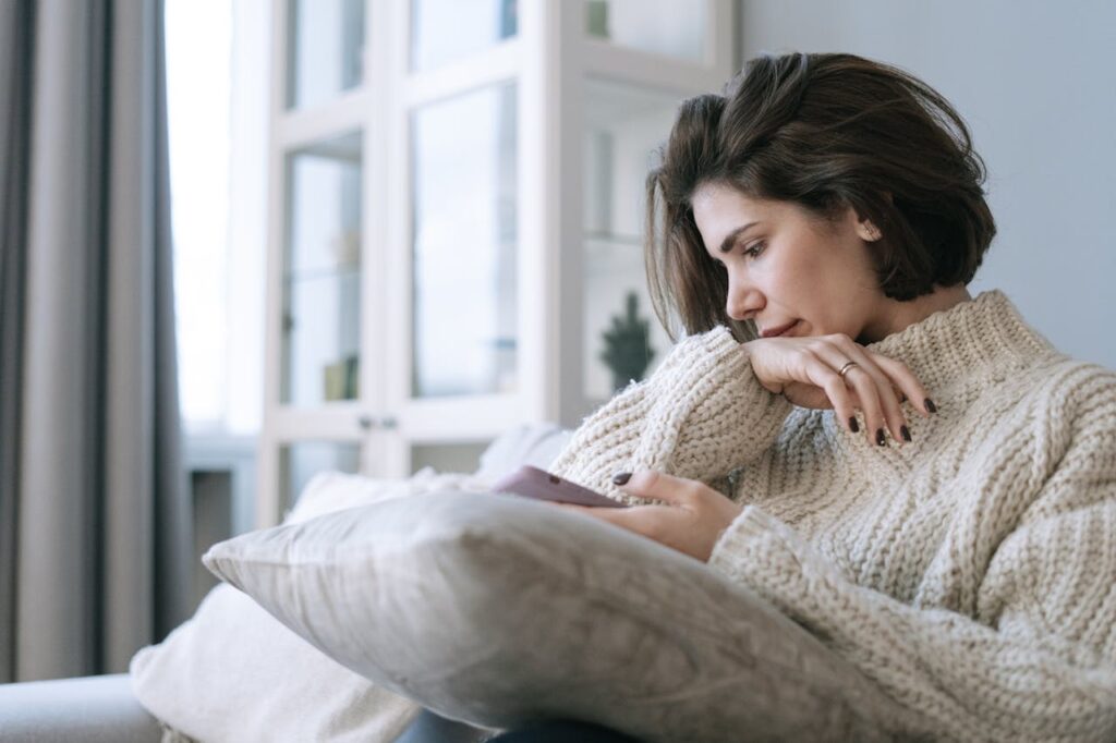 woman psychologically influenced by content on her phone
